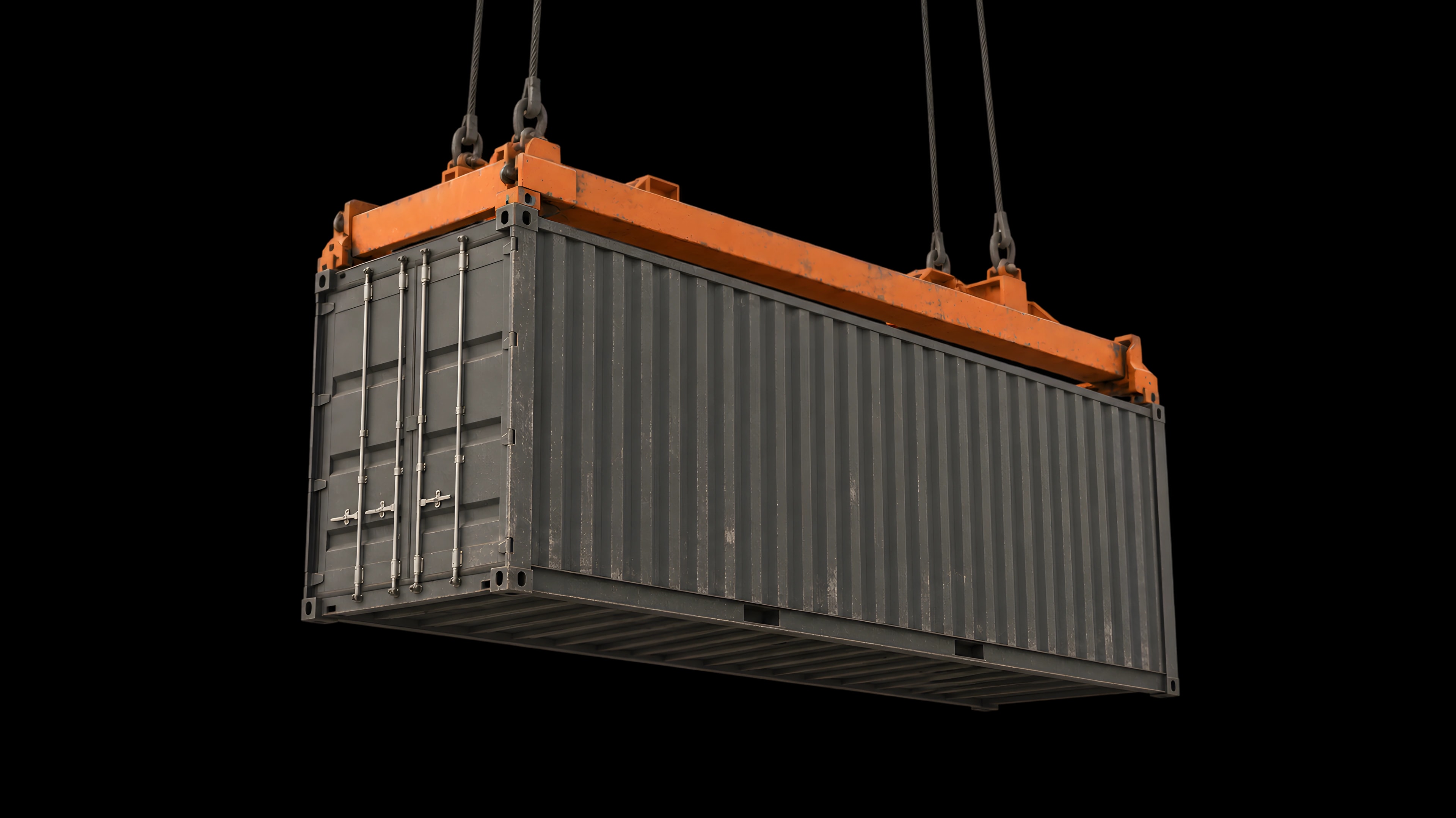 A shipping container suspended from a crane spreader